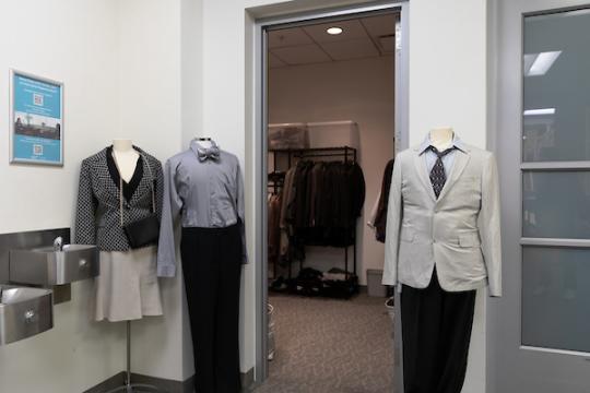 entrance to career closet with three mannequins dressed in professional clothes