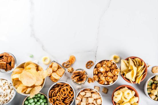 Assorted Snacks on a White Marble Background
